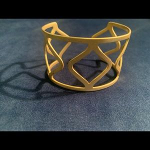Negative space gold tone cuff bracelet